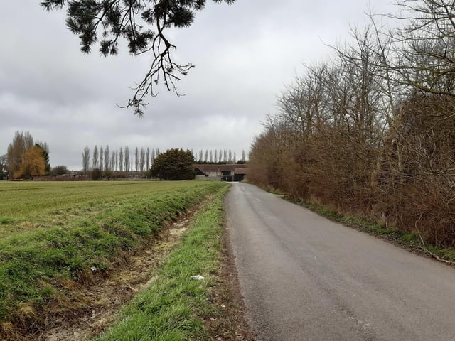 Continue along the road to the bend at the top, where there is a footpath sign