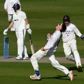 Jack Carson celebrates after dismissing Joe Root in a county championship game (Photo by Mike Hewitt/Getty Images)
