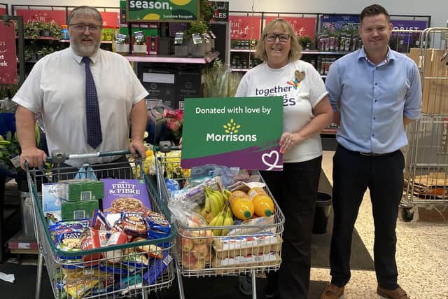 Morrisons Littlehampton store manager Shaun Schofield, community champion Alison Whitburn and ops manager Kirk Jenson. Picture: Morrisons / Submitted