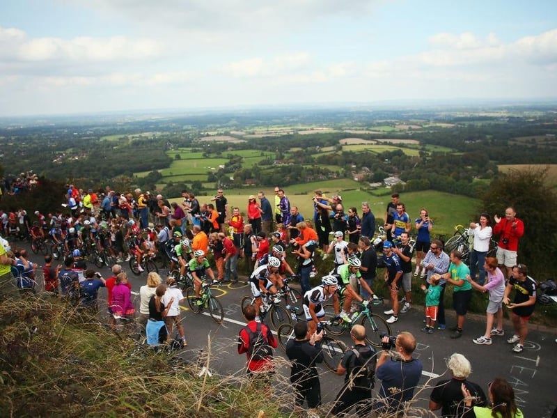 Ditchling Beacon is the highest point in East Sussex, England, with an elevation of 248 m. It is south of Ditchling and to the north-east of Brighton. It is a large chalk hill with a particularly steep northern face, covered with open grassland and sheep-grazing areas. Here the stage seven of the 2014 Tour of Britain is pictured passing through the area.