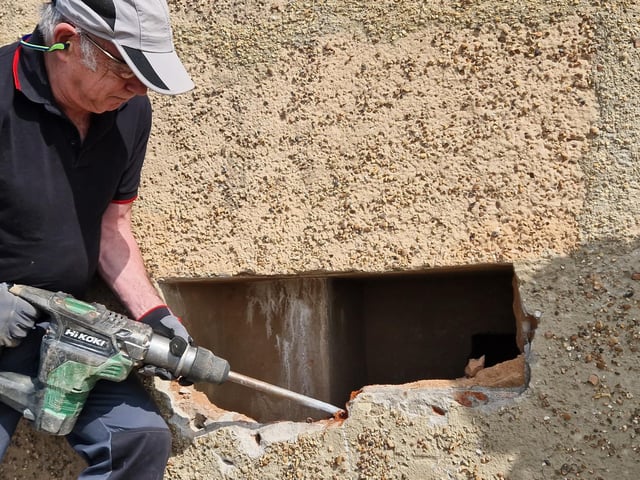 Pete Coe, one of the project leaders, and fellow former Royal Engineer Graham Cosham worked together to open the southern embrasure at the Ferring pillbox
