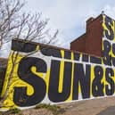 The second on St Luke’s Lane, which reads “sun & sea & you & me”, is by Anthony Burrill.