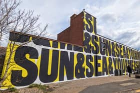 The second on St Luke’s Lane, which reads “sun & sea & you & me”, is by Anthony Burrill.
