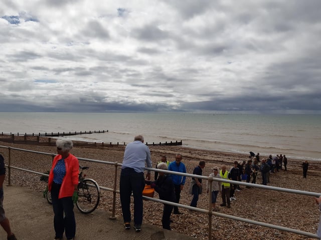 A bucket chain of volunteers from Ferring History Group and Ferring Conservation Group, including Worthing West MP Sir Peter Bottomley, form a bucket chain to bail out nine inches of water from the Ferring pillbox
