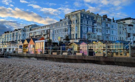 A seaside town in East Sussex known for its historic Old Town and cultural attractions. It offers affordable housing options and a range of amenities, including a pier, beach, and train station