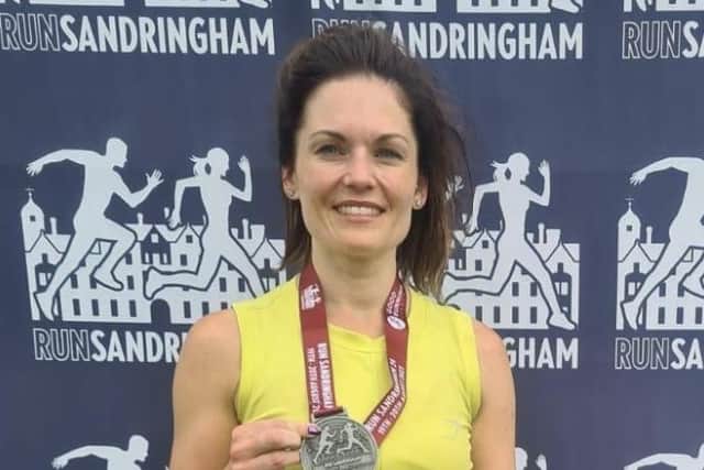 Jodie with her finishers medal at Run Sandringham