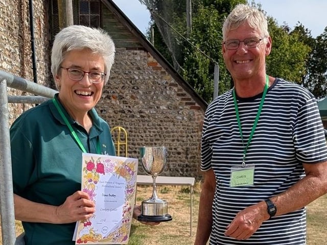 Chairman Chris Hill presents the Cookery Goblet to Diana Buckley