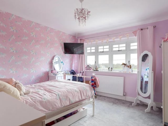 The first floor provides five bedrooms
