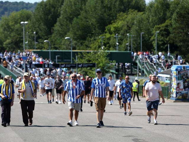 BRIGHTON, ENGLAND - AUGUST 13: Fans of Brighton & Hove Albion make their way towards the stadium prior to the Premier League match between Brighton & Hove Albion and Newcastle United at American Express Community Stadium on August 13, 2022 in Brighton, England. (Photo by Steve Bardens/Getty Images)