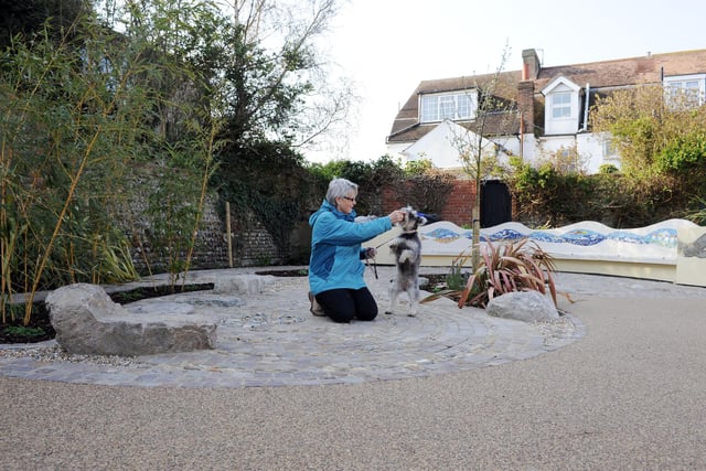 Phyllis Martin and Flossy enjoying Wenceling Sensory Garden ahead of the grand opening