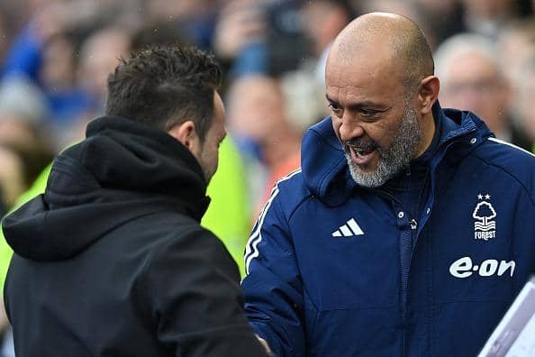 Brighton's Italian head coach Roberto De Zerbi (L) greets Nottingham Forest's Portuguese manager Nuno Espirito Santo ahead of the Premier League clash