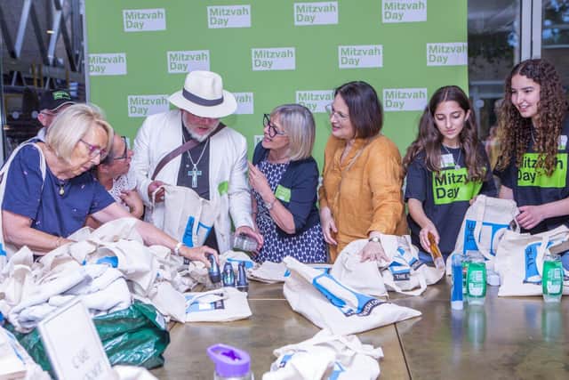 Participants make care packages for people experiencing homelessness at Mitzvah Day launch 