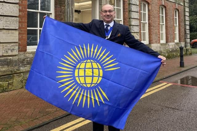 The flag at Horsham District Council's offices at Park House was raised by council vice chairman Nigel Emery to mark Commonwealth Day