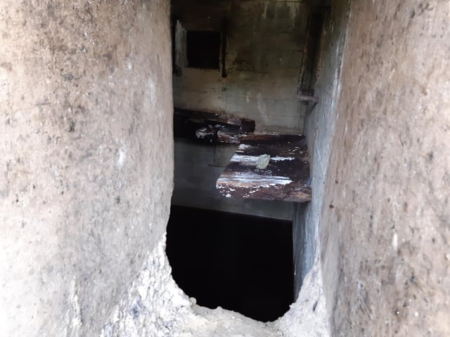 A bucket chain of volunteers from Ferring History Group and Ferring Conservation Group, including Worthing West MP Sir Peter Bottomley, form a bucket chain to bail out nine inches of water from the Ferring pillbox