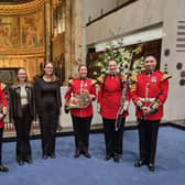 Sophie and Lily with musicians from the Band of the Grenadier Guards.