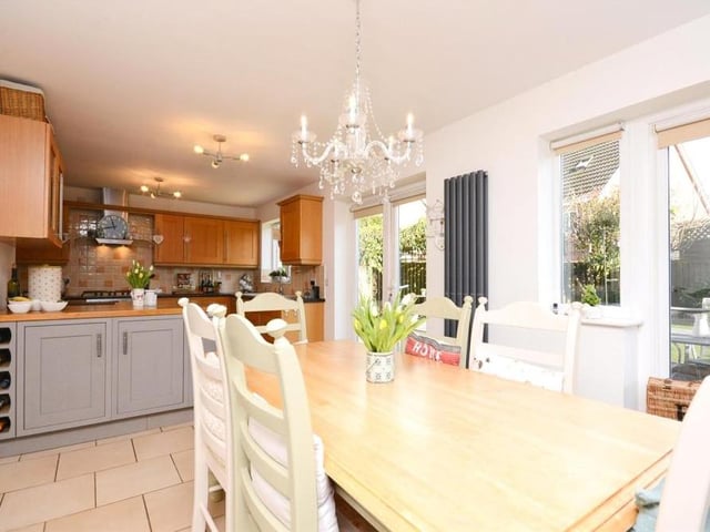 The kitchen is so large, there is plenty of room for a family breakfast table, so you can start the day in style. Two sets of French doors lead out to the garden.