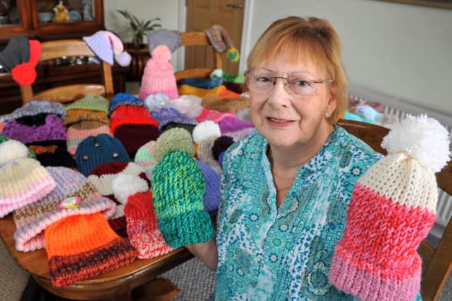 Anita Gillam has now knitted more than 130 winter hats, which she hopes to ship out to Ukraine which was invaded by Russia in February.  Photo: Steve Robards SR2208221