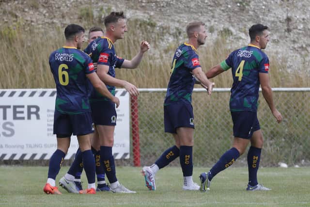 Jack Strange (centre) is congratulated after firing Horsham ahead at Whitehawk on Bank Holiday Monday