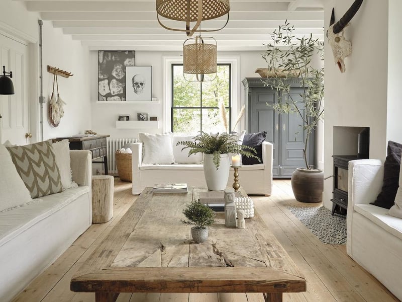 The impressive double aspect sitting room features a wood burning stove
