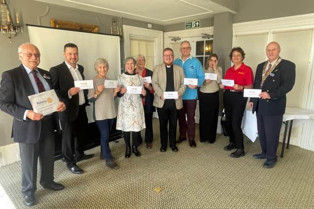 Charity cheques are presented by the Rotary Club of Eastbourne