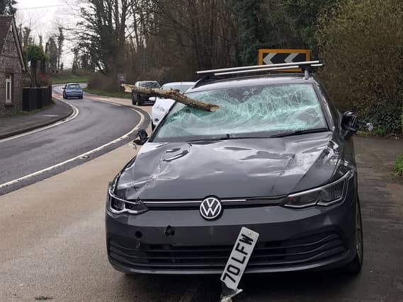 A woman had her car windscreen smashed by a tree branch whilst she was driving to see her parents in Ditchling.