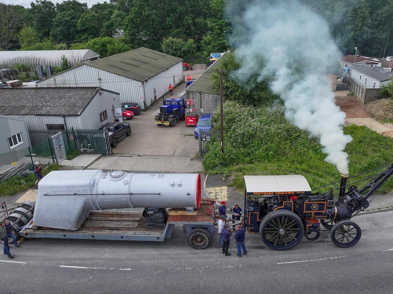 A vintage steam engine was seen slowly hauling a heavy load though Burgess Hill on Wednesday, June 12