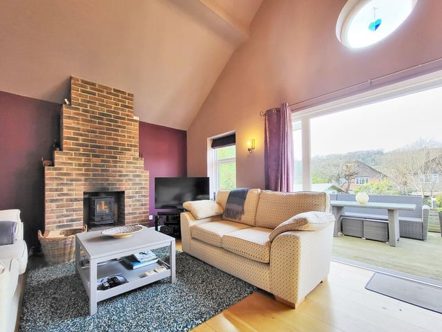 The Findon Valley home has a large, open plan lounge/kitchen/diner with log burner, beautiful vaulted ceiling and amazing views over the rear garden.