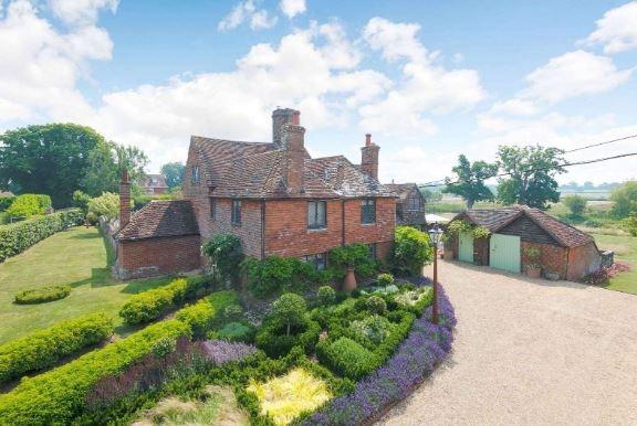 The formal gardens lie around the house, laid to beautifully tended lawn dotted with well-stocked and colourful borders including box, lavender and grasses; extending away from the house to the east is a part-walled parterre garden with central pergola.
