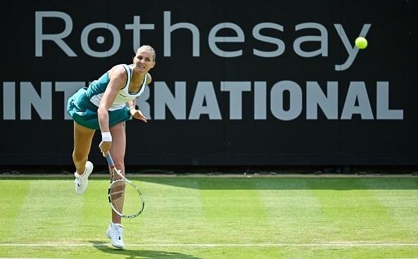 Czech Republic's Karolina Pliskova serves the ball to Belgium's Elise Mertens