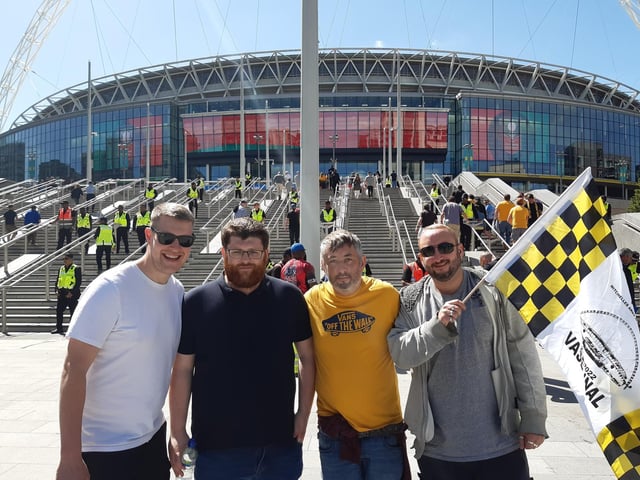 Flying the flag as fans arrive at Wembley Stadium ahead of historic FA Vase final clash