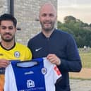 In happier times: Martin Dynan pictured when he signed Dom Pires for Heath