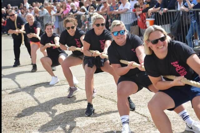 Taking the strain in the Tug O War contest in Hastings Old Town Carnival Week