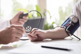 Doctor checking the blood pressure of a patient. Photo for illustrative purposes only.