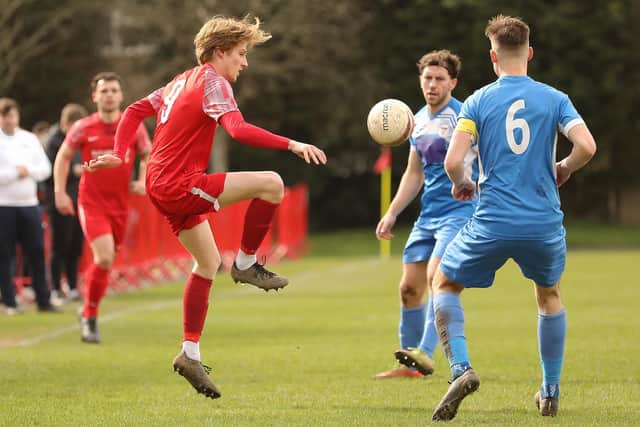 Bosham's Lewis Rustell in action against Jarvis Brook | Picture: Chris Hatton