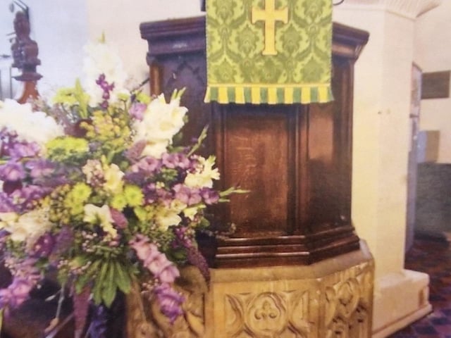 The dark oak pulpit was removed to create a more open space