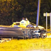 Police officers were called after a car overturned on a roundabout in Crawley