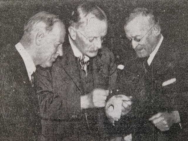 Dr Eliot Curwen, centre, making a close examination of the Ovingdean skull, which had been recently found, before a lecture to Brighton and Hove Archaeological Club in Brighton