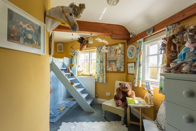 "Nooks and crannies throughout make this home a joy for children as well as this bespoke-built bunk bed with playhouse underneath. "