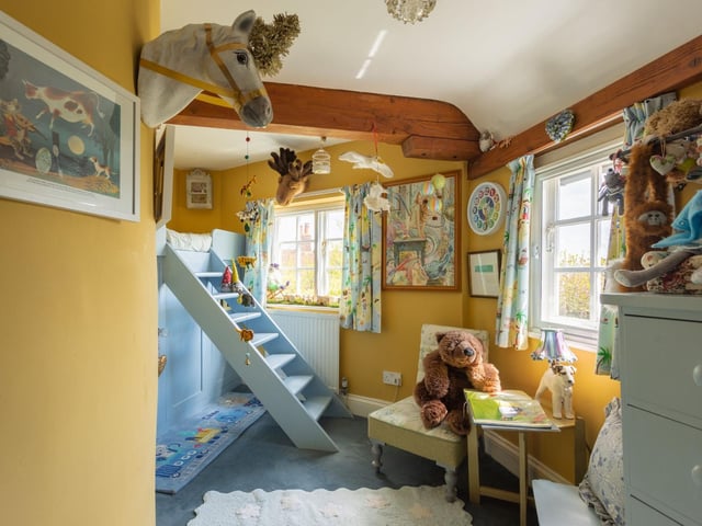 "Nooks and crannies throughout make this home a joy for children as well as this bespoke-built bunk bed with playhouse underneath. "