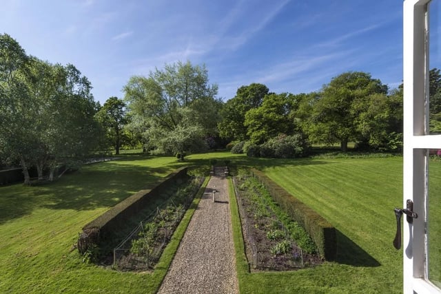 The gardens have formal lawns and paths with well stocked herbaceous borders