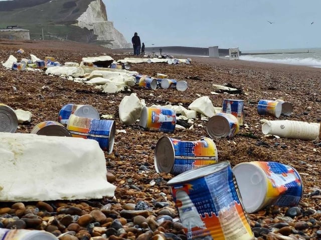 Milk cans and polystyrene on Seaford beach.
