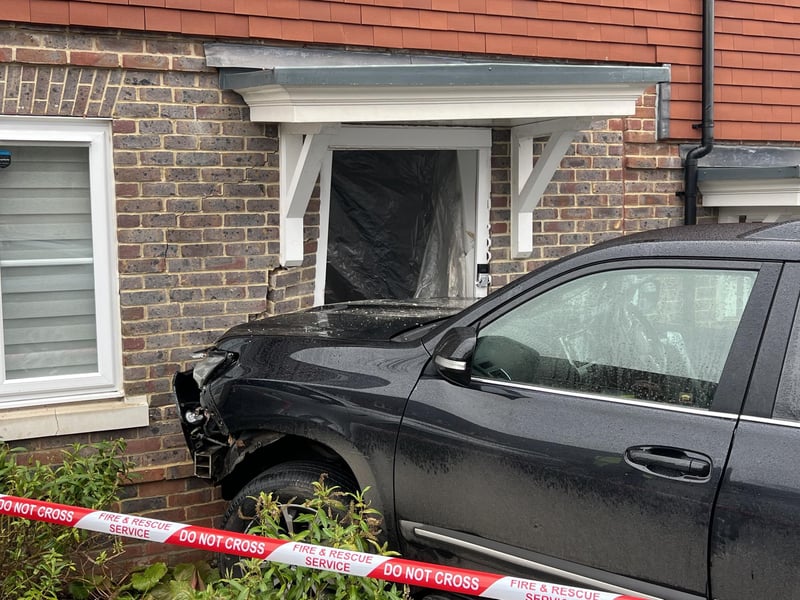 The emergency services were called to Clockfield in Turners Hill after a car collided with a house on Christmas Day.