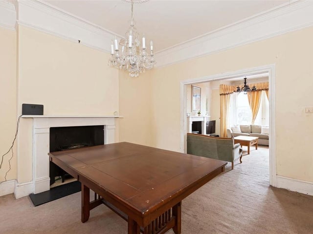The dining room with the original fireplace