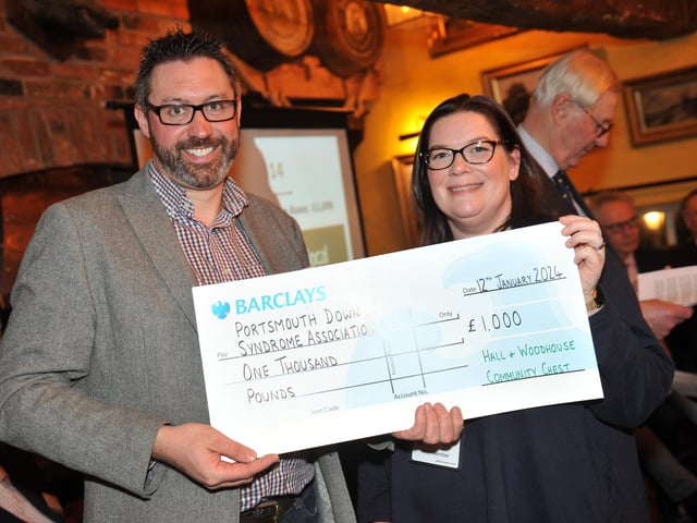 Judge Steve Young presents a cheque for £1,000 to Portsmouth Down Syndrome Association
