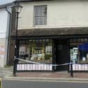 The Sussex Sweet Shop is closed to customers, with an ambulance also pictured on the opposite side of the road