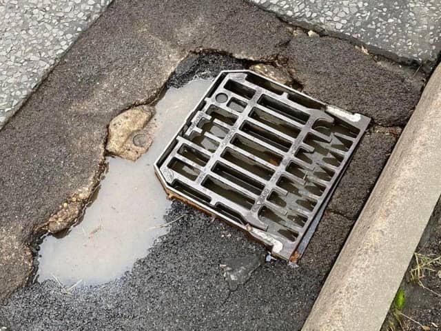 The pothole has only been partially repaired. Photo: Eddie Mitchell