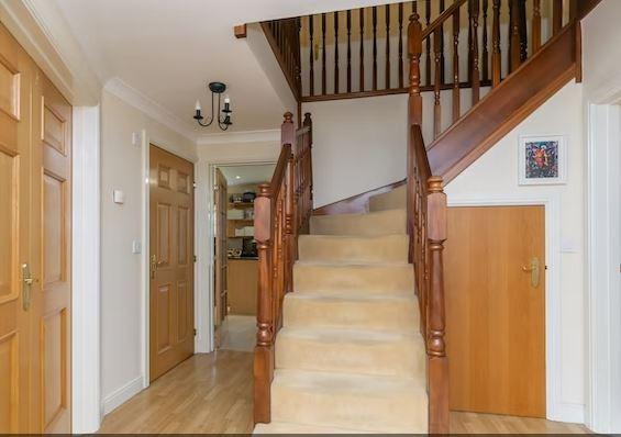 The front door opens to a large reception hall and useful downstairs cloakroom.