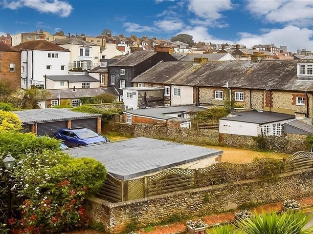 This modern town house with waterside garden is tucked away on a desirable private development in the heart of Arundel. It comes to the market with Cubitt & West, priced at £700,000.