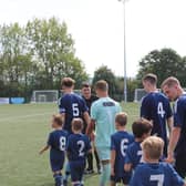 Ringmer players walk out with mascots before Saturday's match. Picture: Will Hugall