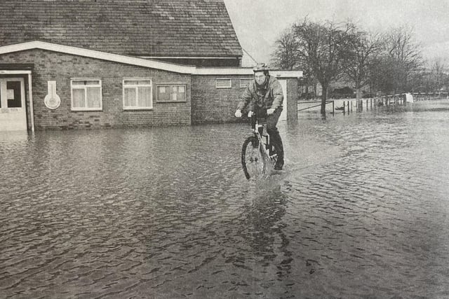 This resident didn't let the floods get in the way of his bike ride.